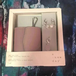 A new day ear bud case with charms